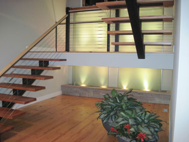 Residential Water Feature: Lighted Glass Wall Behind Stairway