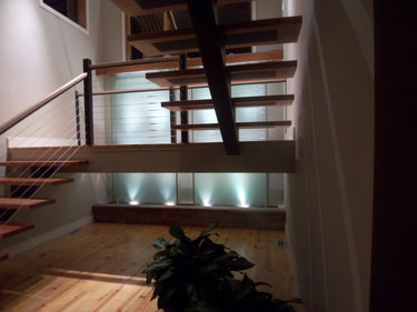 Residential Water Feature: Lighted Glass Wall Behind Stairway