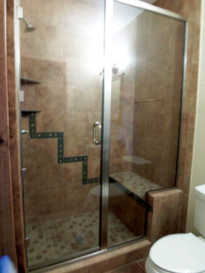 Door and panel with brushed nickel metal - through the glass D-handle